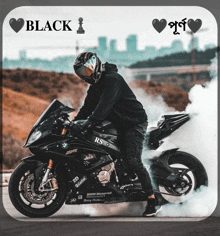 a man riding a black motorcycle with the words black i on it