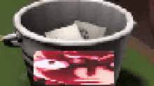 a pixelated image of a bucket with a picture of a woman on it