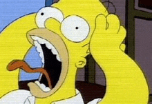 homer simpson is making a funny face with his mouth open and his tongue out .