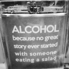 a flask with the words alcohol because no great story ever started with someone eating a salad on it .