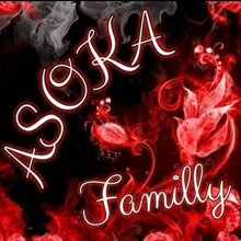 a sign that says asoka family with red flowers in the background