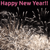 a picture of fireworks with the words happy new year written in pink