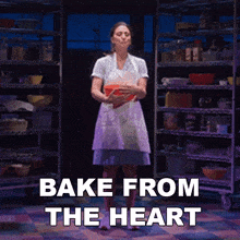 a woman in a white apron is holding a bowl with the words bake from the heart written below her