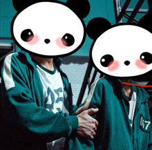 a couple of pandas standing next to each other with the number 07 on their jacket