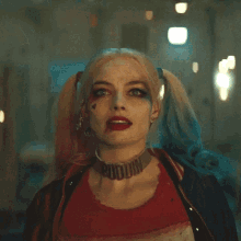 harley quinn wearing a choker that says puddin on it