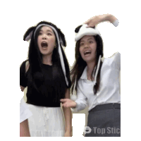 two women wearing bunny hats are standing next to each other with top stickers in the corner