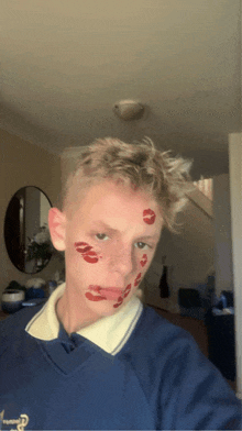 a boy with red lips on his face