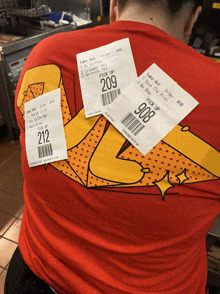 a man wearing a red shirt has a bunch of tickets on his back including one that says pick up 209