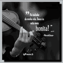 a black and white photo of a person holding a violin with a quote from marcelo souza