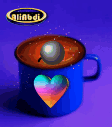 a blue coffee cup with a heart and a ball in it