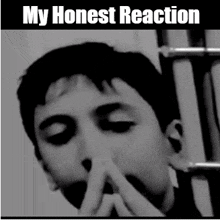 a black and white photo of a boy with the words my honest reaction above him