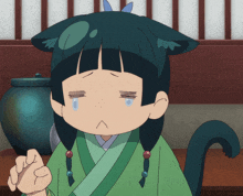 a cartoon girl with a cat ear has a tear running down her face