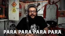 a man with a beard and glasses is holding a bat and says para para para para