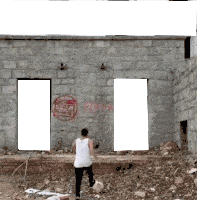 a man standing in front of a brick wall with graffiti on it that says ' i love you '