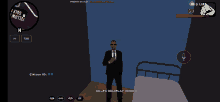 a man in a suit and tie is standing in front of a bed in a game called gs life roleplay member