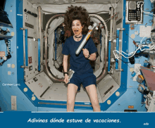 a picture of a woman in a space station with the caption adivinas donde estuve de vacaciones