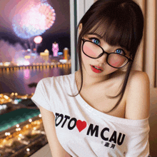 a girl wearing glasses and a white t-shirt that says toto mcau