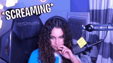 a girl with curly hair is sitting in front of a respawn chair