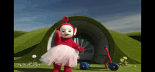 a red teletubbies character in a pink tutu