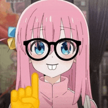 a girl with pink hair and glasses is making a rock sign with her finger .