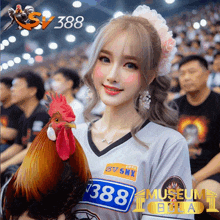 a woman is holding a rooster with the number 388 on her shirt