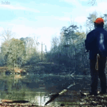 a man in a hard hat stands in front of a body of water with the word jackie on the bottom right