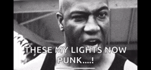 a black and white photo of a man with the words these my lights now punk