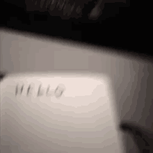 a close up of a computer keyboard with the word hello written on it
