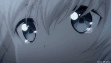 a close up of a person 's eyes with the words omake gif anime below