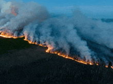 an aerial view of a fire burning in the woods