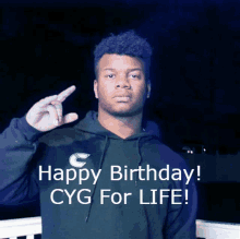 a man wearing a black hoodie with the words happy birthday cyg for life on it