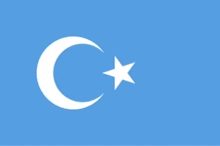 a blue flag with a crescent moon and a star