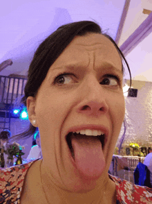 a woman making a funny face with her tongue hanging out