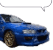 a blue car with gold wheels and a speech bubble above it .