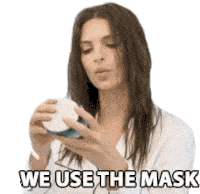 a woman is holding a mask in her hands and says we use the mask