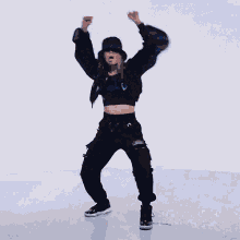 a woman is dancing in front of a blue background with the hashtag #kda on it