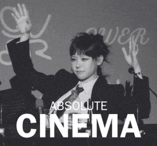 a black and white photo of a woman in a suit and tie with the words " absolute cinema " below her