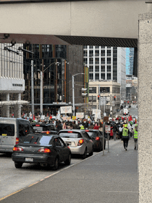 a busy city street with a sign that says no parking on it