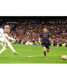 a soccer player wearing an etihad airways jersey kicks a ball