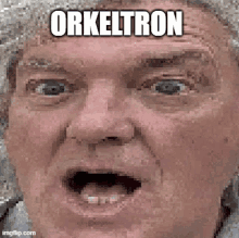 a pixelated image of a man 's face with the words `` orkeltron '' written above it .