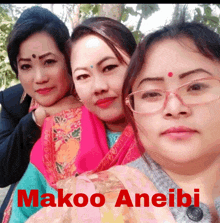 three women posing for a picture with makoo aneibi written on the bottom right