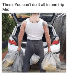 a man is carrying bags of food in front of a car