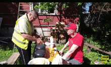 a man in a red shirt is talking to another man in a yellow vest and a sign that says subik daily