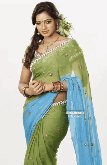 a woman in a green and blue saree with idlebrains.com exclusive