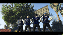 a group of men are standing in front of a billboard wearing varsity jackets with skulls and crossbones on them