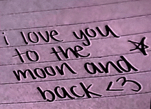 a handwritten note that says i love you to the moon and back