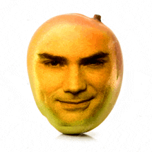 a mango has a man 's face on it