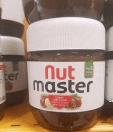 a jar of nut master is on a yellow shelf