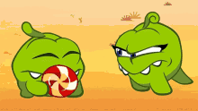 a green cartoon character holding a red and white candy