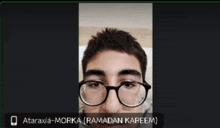 a picture of a man with glasses and the name ataraxia-morka ramadan kareem